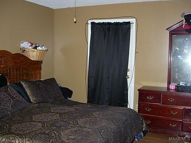 bedroom with wood finished floors