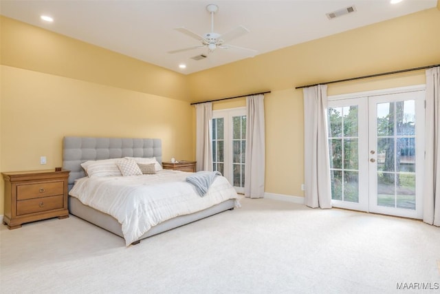 bedroom featuring light carpet, access to outside, visible vents, and french doors