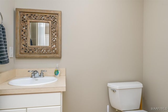 half bath with vanity and toilet