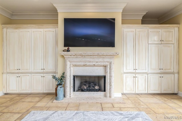 unfurnished living room featuring ornamental molding and a premium fireplace