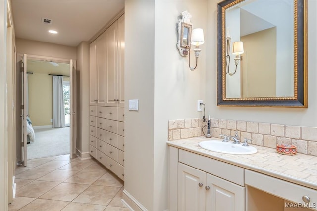 bathroom featuring recessed lighting, visible vents, vanity, tile patterned flooring, and baseboards