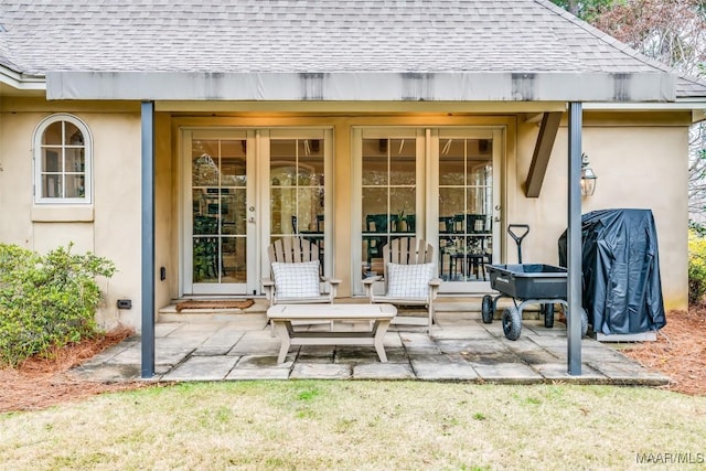 view of patio with french doors and a grill