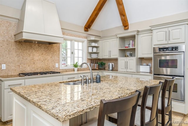 kitchen featuring white cabinets, premium range hood, open shelves, and stainless steel appliances