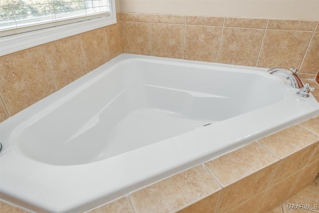bathroom featuring tiled bath