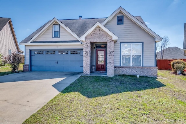 view of front of property featuring a garage, driveway, brick siding, and a front lawn