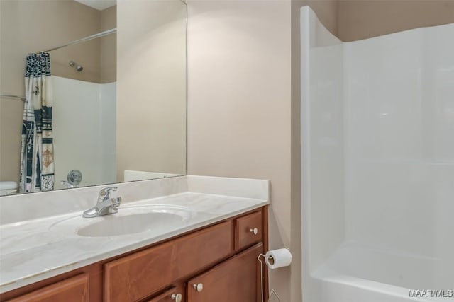 bathroom with vanity and shower / tub combo with curtain
