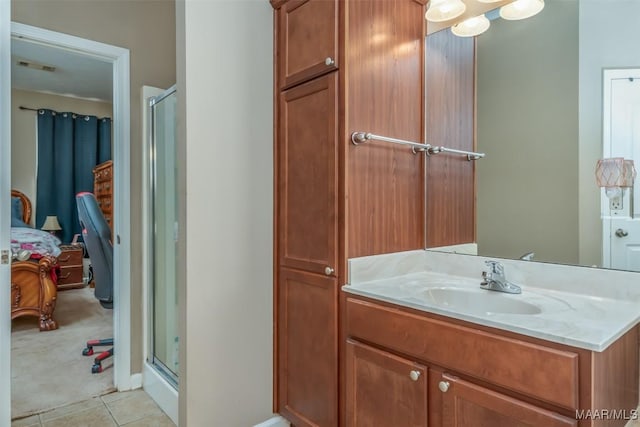 full bathroom with tile patterned flooring, a shower stall, ensuite bath, and vanity