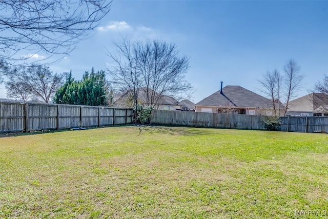 view of yard featuring a fenced backyard
