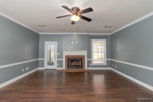 unfurnished living room with a textured ceiling, a fireplace, visible vents, and dark wood-type flooring