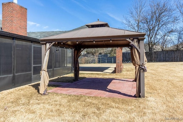 view of patio / terrace featuring fence and a gazebo