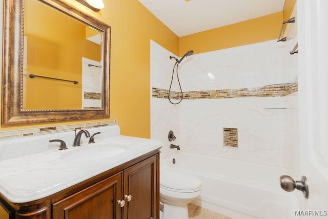 full bathroom featuring toilet, washtub / shower combination, and vanity