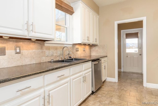 kitchen with a sink, a healthy amount of sunlight, white cabinetry, and dishwasher