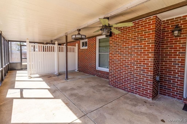 view of patio / terrace featuring ceiling fan and fence