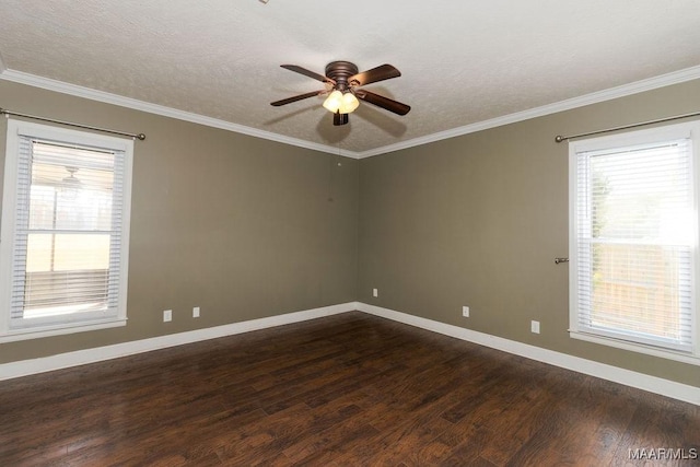 unfurnished room featuring crown molding, dark wood finished floors, and baseboards