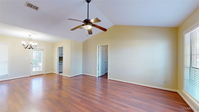 unfurnished room featuring vaulted ceiling, dark wood finished floors, visible vents, and baseboards