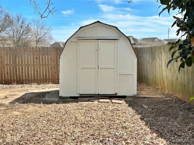 view of shed with a fenced backyard