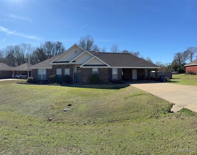 view of front of property featuring concrete driveway, brick siding, and a front yard