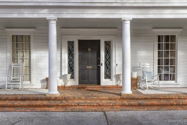 entrance to property with covered porch
