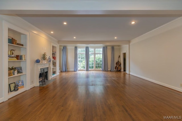 unfurnished living room with baseboards, ornamental molding, dark wood-type flooring, and a high end fireplace