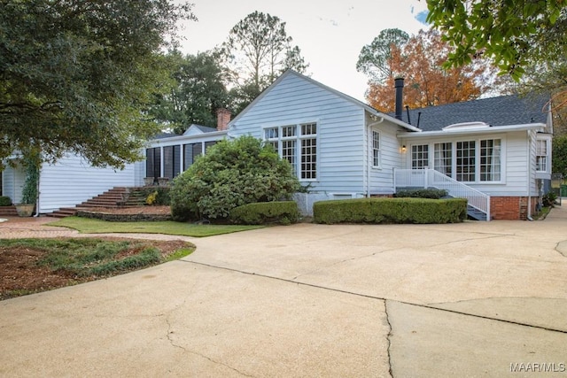back of property with stairs