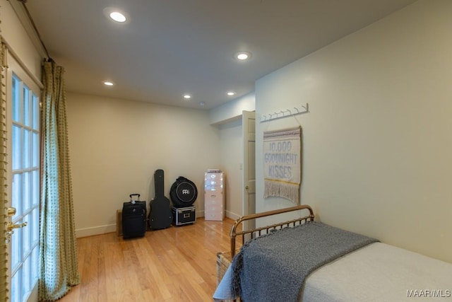 bedroom featuring recessed lighting, baseboards, and wood finished floors