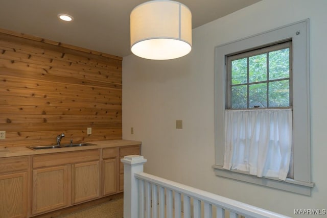 interior space featuring a sink and recessed lighting