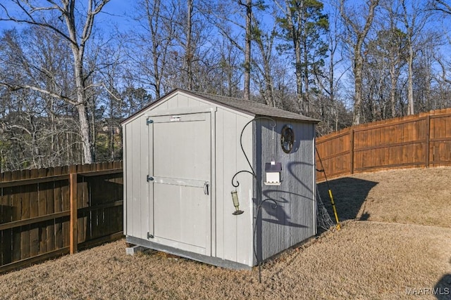 view of shed with a fenced backyard