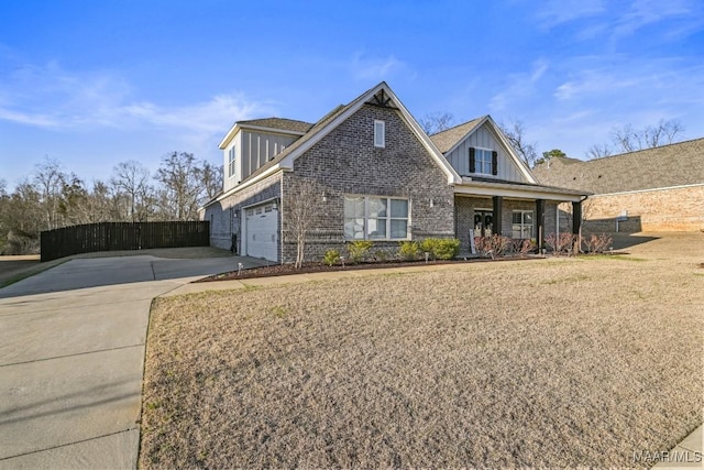 view of front facade featuring an attached garage, brick siding, fence, concrete driveway, and a front lawn