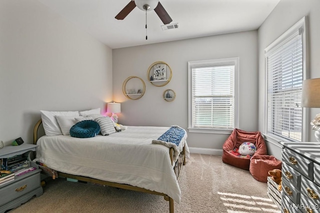 bedroom featuring carpet, visible vents, ceiling fan, and baseboards