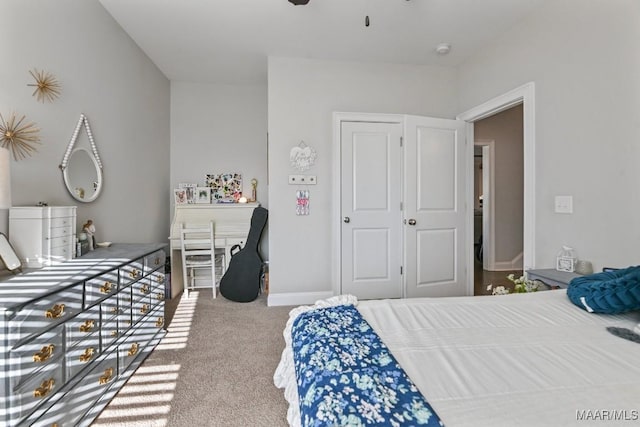 bedroom with ceiling fan, carpet flooring, and baseboards