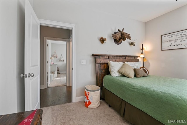 carpeted bedroom with baseboards