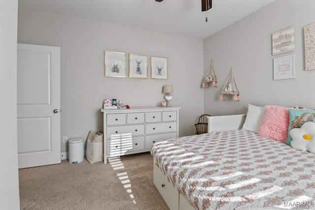 bedroom featuring a ceiling fan and light carpet