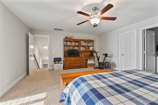 carpeted bedroom with baseboards, visible vents, and a ceiling fan