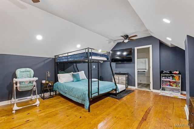 bedroom with lofted ceiling, wood finished floors, a ceiling fan, and baseboards