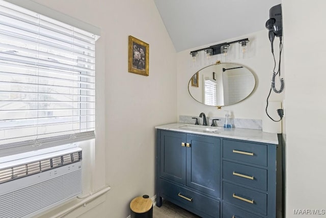 bathroom featuring cooling unit, vaulted ceiling, and vanity