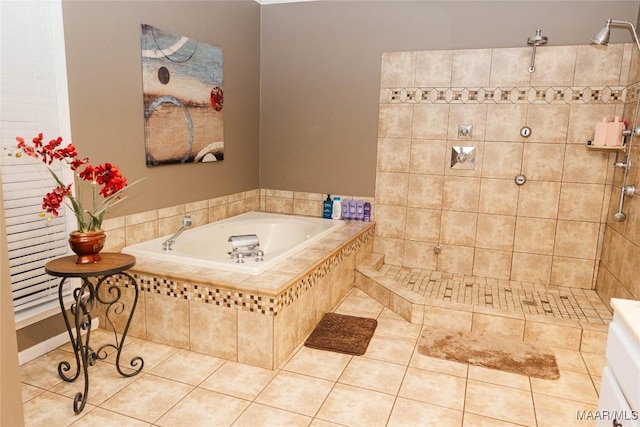 bathroom featuring a tile shower, a bath, and tile patterned floors