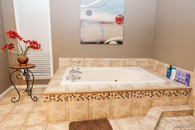 bathroom featuring a garden tub and tile patterned flooring