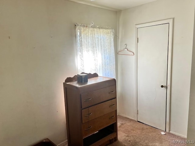 bedroom featuring light colored carpet