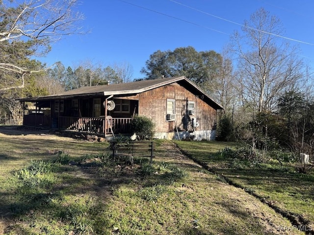 view of front of house with cooling unit and covered porch