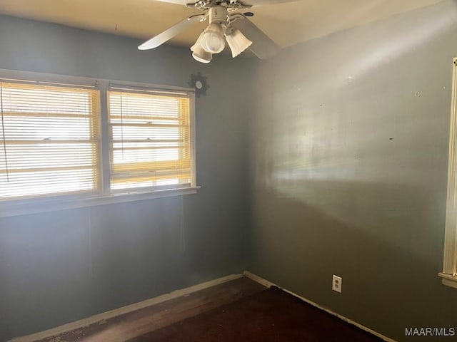 unfurnished room with ceiling fan and wood finished floors