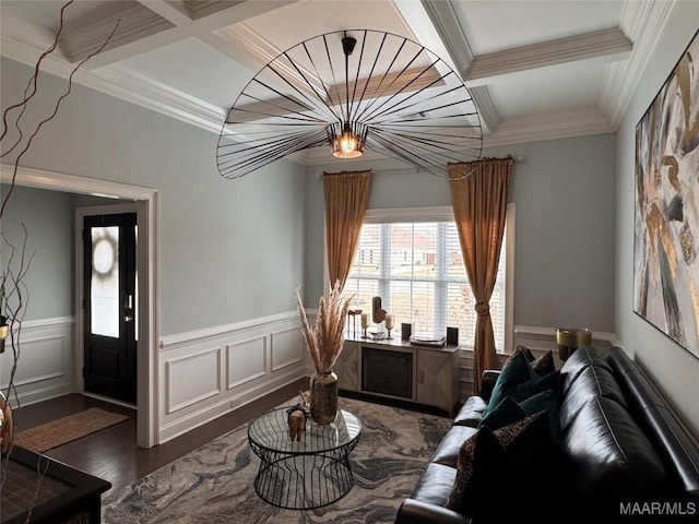 living area with a wainscoted wall, coffered ceiling, dark wood finished floors, and beamed ceiling