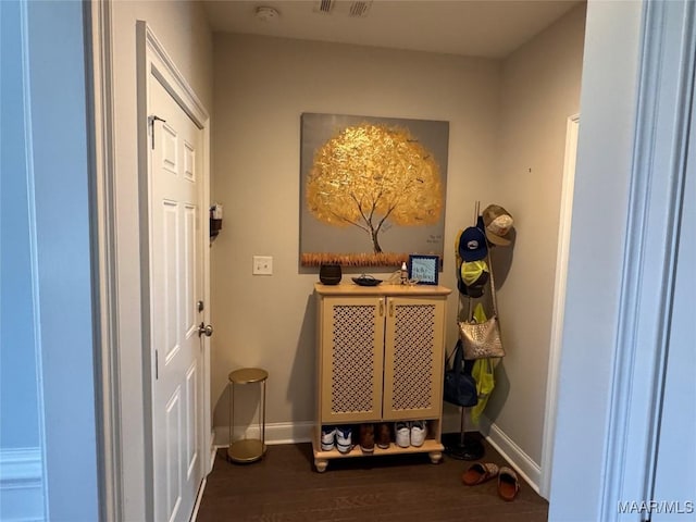 interior space with dark wood-style flooring and baseboards