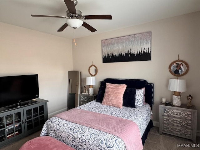 bedroom with dark carpet, baseboards, and ceiling fan