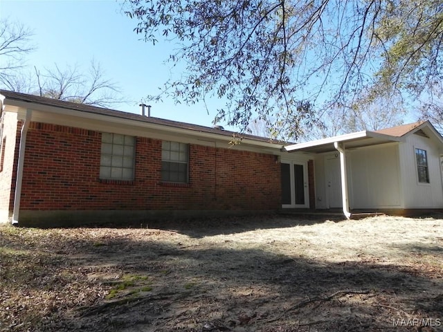 view of side of property with brick siding