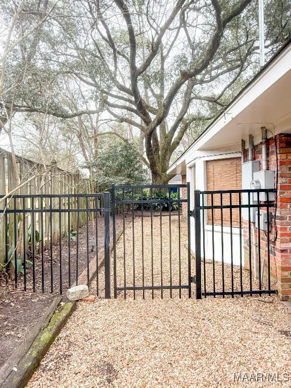 view of gate featuring fence