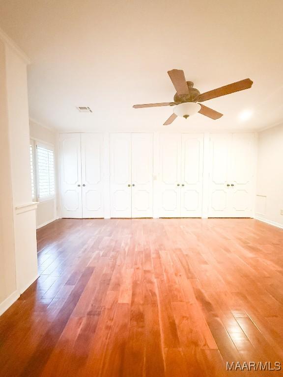 empty room featuring a ceiling fan and light wood-style flooring