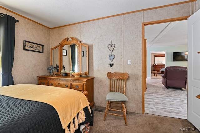 bedroom featuring ornamental molding and carpet flooring