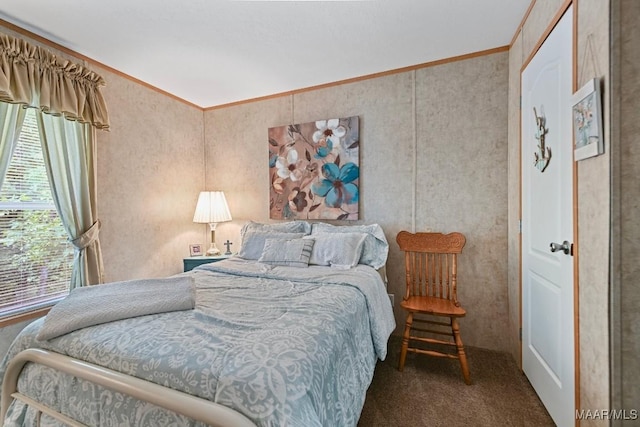 bedroom with ornamental molding and carpet