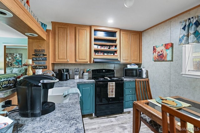 kitchen featuring light stone counters, light wood-style flooring, under cabinet range hood, black electric range, and brown cabinetry