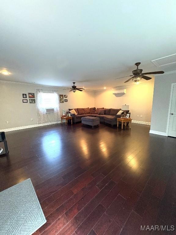 living room with baseboards, dark wood finished floors, and a ceiling fan